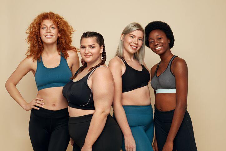 4 women with diverse body types dressed to exercise to get in shape