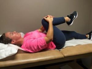 single knee to chest stretch at JOI Rehab 